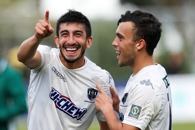 WELLINGTON, NEW ZEALAND - MAY 07:  Emiliano Tade and Clayton Lewis of Auckland City celebrate after winning the OFC Champions League Final match between Team Wellington and Auckland City at David Farrington Park on May 7, 2017 in Wellington, New Zealand.  (Photo by Hagen Hopkins/Getty Images)