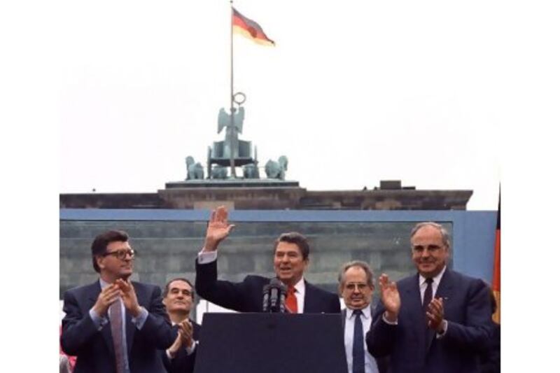 Ronald Reagan acknowledges the crowd after his speech in front of the Brandenburg Gate in West Berlin on June 12, 1987, in which he urged the Soviet president, Mikhail Gorbachev, to 'tear down this wall!'