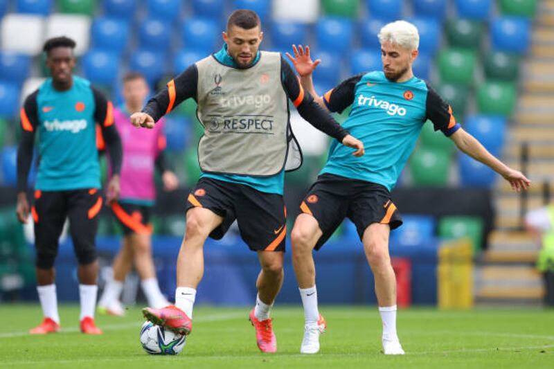 Mateo Kovacic battles for possession with Jorginho during Chelsea's training session at Windsor Park in Belfast.
