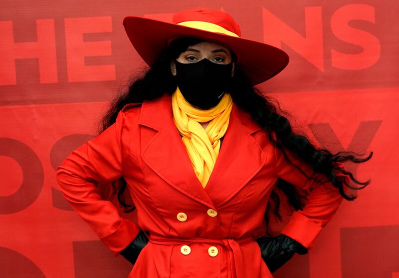 A woman cosplays as Carmen Sandiego at New York Comic Con. Timothy A Clary / AFP