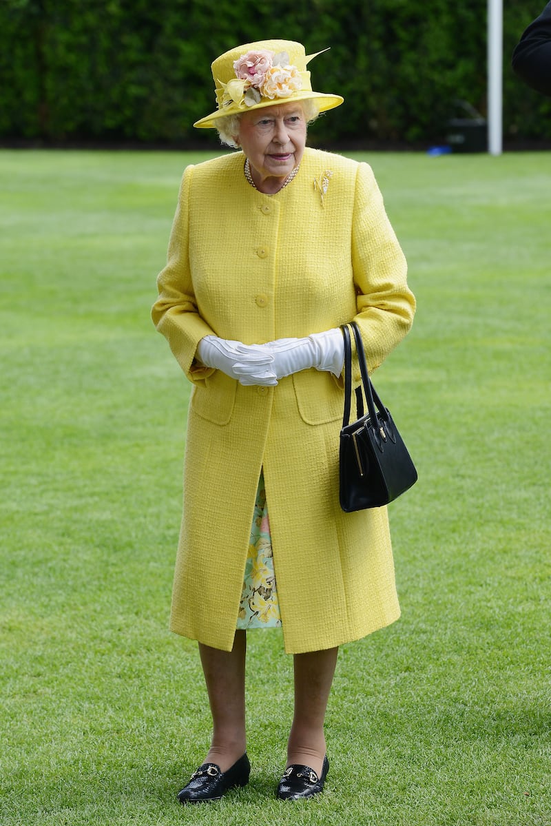 Queen Elizabeth II, wearing yellow, attends Royal Ascot 2015 at Ascot racecourse on June 19, 2015 in Ascot, England. Getty Images