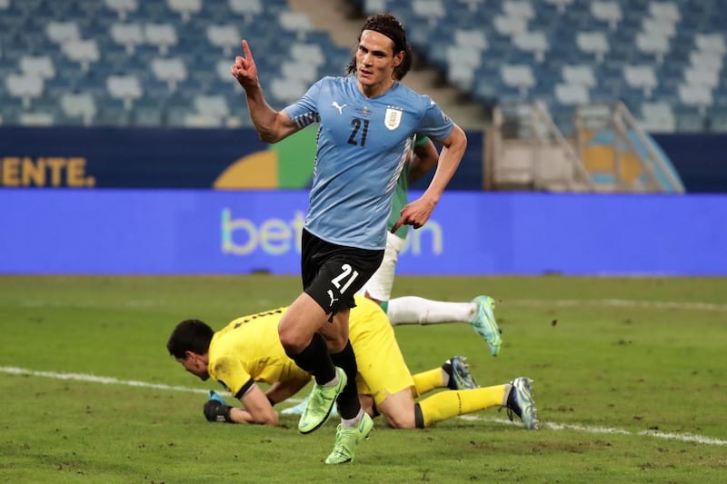 Edinson Cavani celebrates after scoring Uruguay's second goal against Bolivia. EPA