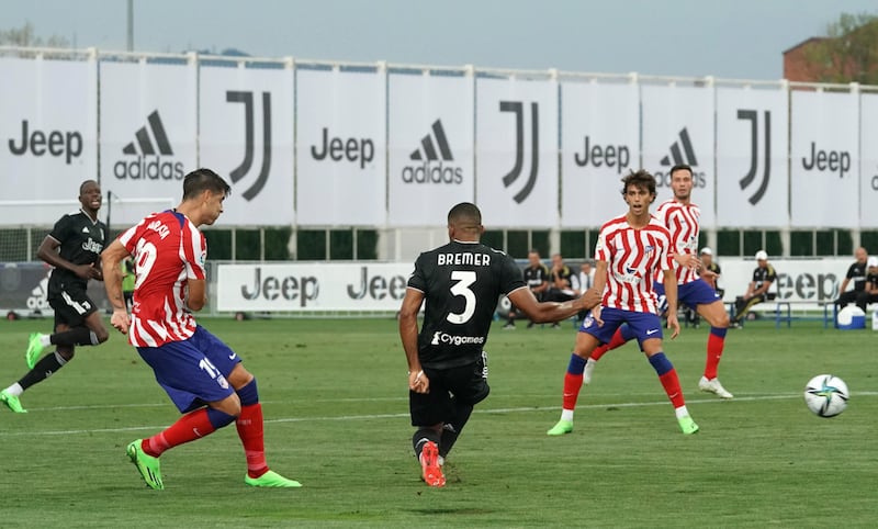 Atletico Madrid's Alvaro Morata scores their second goal in a friendly against Juventus. EPA