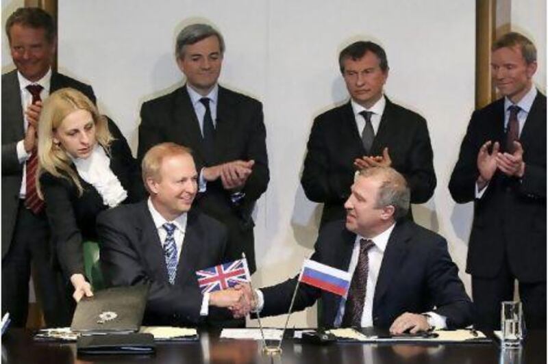 Bob Dudley, left, the chief executive of BP, shakes hands with Eduard Khudainatov, chief executive of Rosneft Oil, at the BP headquarters in London.