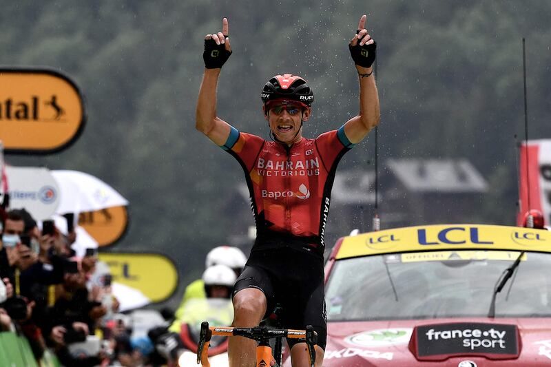 Team Bahrain's Dylan Teuns of Belgium celebrates as he crosses the finish line.