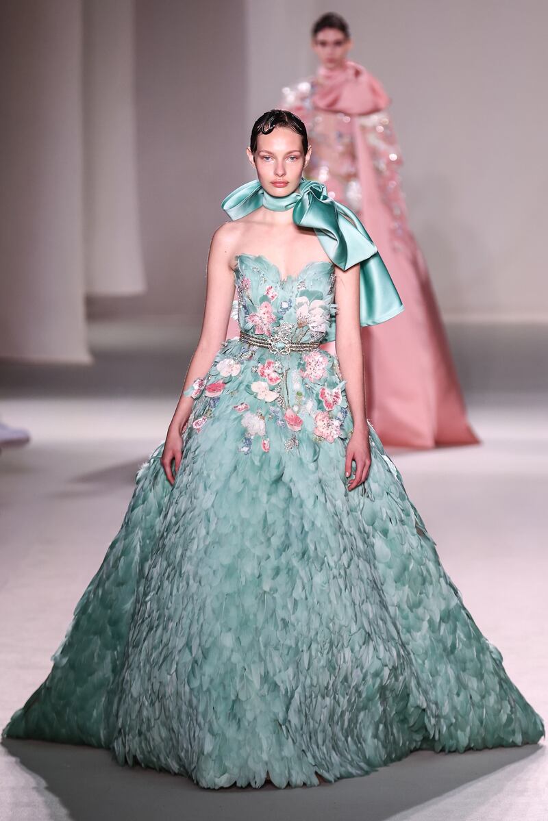 The Elie Saab spring 2023 haute couture show offered this feathered gown in seafoam green. EPA 
