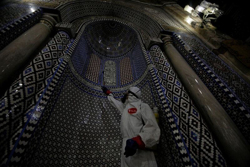 Disinfecting is a vital part of preparing Al Hussein mosque to receive worshippers during the holy month.  Reuters