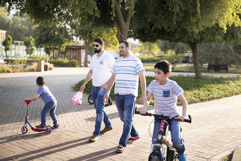 ABU DHABI, UNITED ARAB EMIRATES - JANUARY 16, 2019.

Mfadi Al Jasser, right, with his brother and sons in Heritage park on Abu Dhabi's corniche.

(Photo by Reem Mohammed/The National)

Reporter: Shireena
Section:  NA