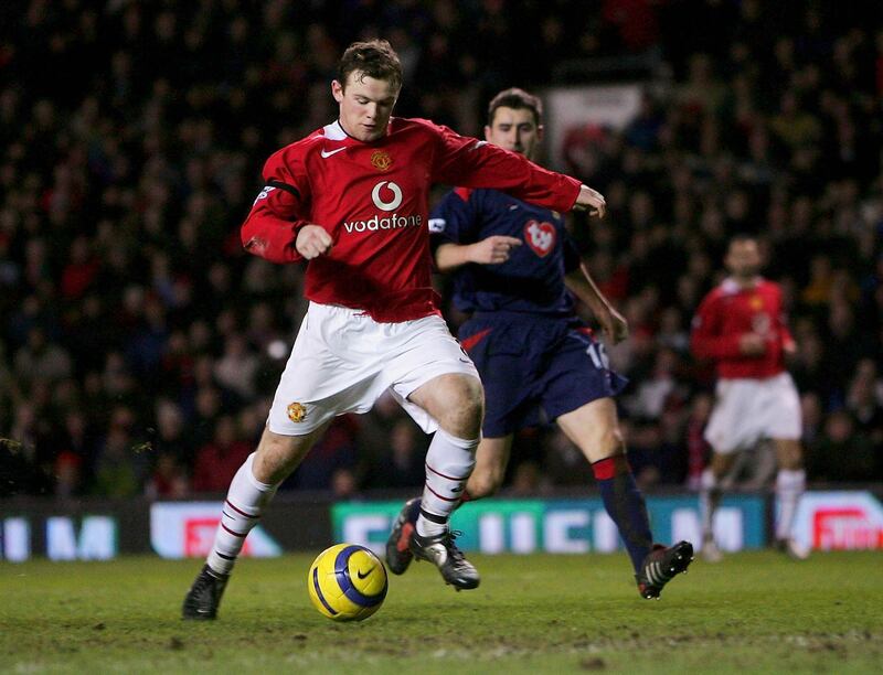 MANCHESTER, ENGLAND - FEBRUARY 26: Wayne Rooney scores Manchester United's second and winning goal during the Barclays Premiership match between Manchester United and Portsmouth at Old Trafford on February 26, 2005 in Manchester, England.  (Photo by Stu Forster/Getty Images)