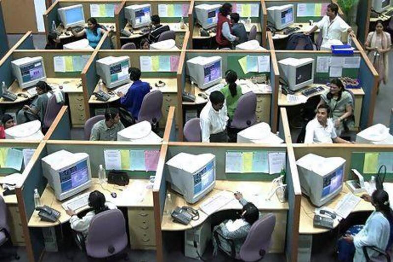 A call centre in Bangalore. India's IT sector is the main beneficiary of a weak rupee that has plunged more than 20% in recent months. Jagadeesh NV / Reuters