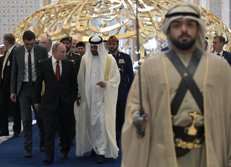 Mr. Putin and Sheikh Mohamed bin Zayed attend the official welcome ceremony in Abu Dhabi. Reuters