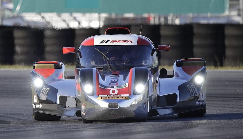 Katherine Legge, of England, drives the DeltaWing DWC13 during qualifying for the IMSA Series Rolex 24 hour auto race on Thursday. John Raoux / AP