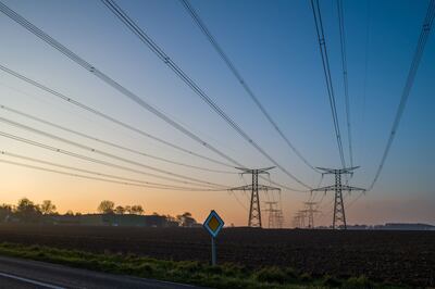 Electricity pylons and power lines near the Paluel nuclear power plant in France. Bloomberg 