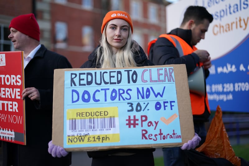 A junior doctor on a picket line outside Leicester Royal Infirmary. The four-day strike is expected to lead to 350,000 appointments being cancelled. PA

