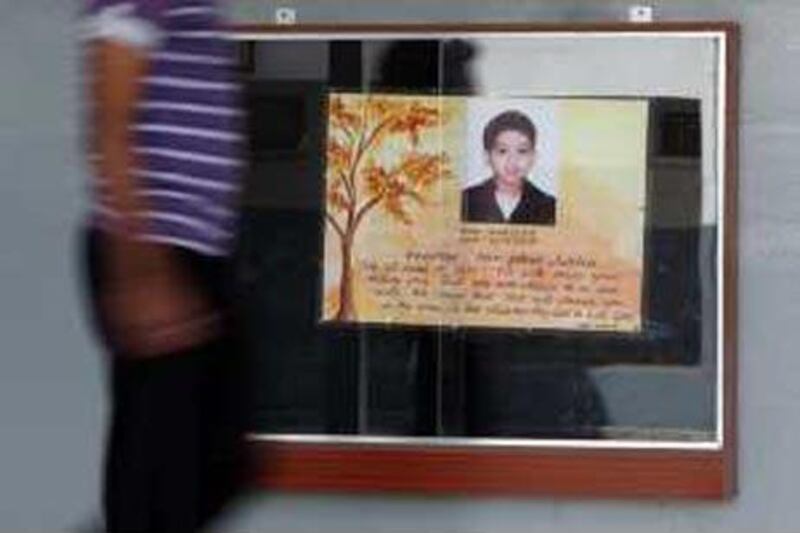 A showcase displays a memorial to Ashton Saldanha at Emirates English Speaking School in Dubai.