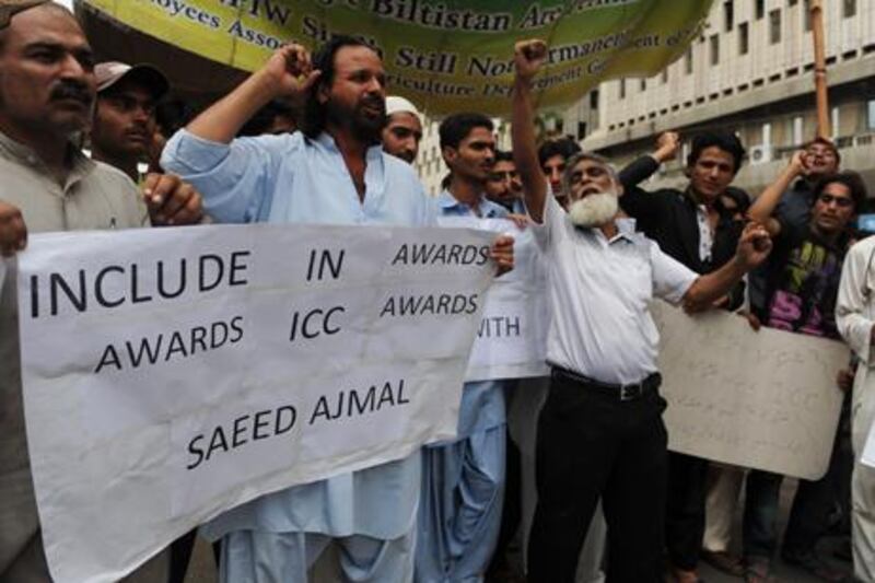 Protestors campaign in Karachi over the exclusion of Saeed Ajmal from the ICC Awards nominations.