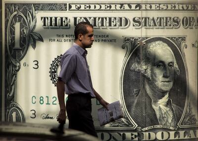 A man outside a foreign exchange office in Cairo, Egypt. AP