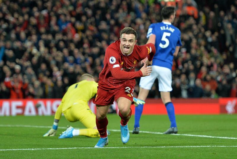 epa08044984 Xherdan Shaqiri of Liverpool celebrates after scoring the 2-0 during the English Premier League soccer match between Liverpool FC and Everton in Liverpool, Britain, 04 December 2019.  EPA/Peter Powell EDITORIAL USE ONLY. No use with unauthorized audio, video, data, fixture lists, club/league logos or 'live' services. Online in-match use limited to 120 images, no video emulation. No use in betting, games or single club/league/player publications