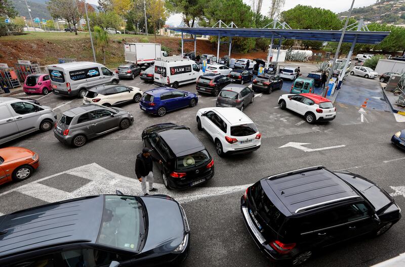 Drivers queue to fill their tanks at a petrol station in Nice. Reuters