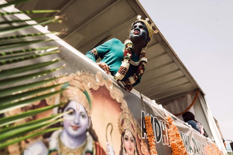 A young Hindu devotee looks on during a street parade as part of the preparations of the two-days celebrations for the Diwali Hindu festival (Festival of Lights) at the old Drive-Inn in Durban, on October 19, 2019. The two-day festival attracts over 100,000 visitors. The festival celebrations include, parading of floats, chariots, singing of devotional songs, dances, games, face painting, food stalls of vegetarian food, clothing, display of toys and jewellery. YAFP