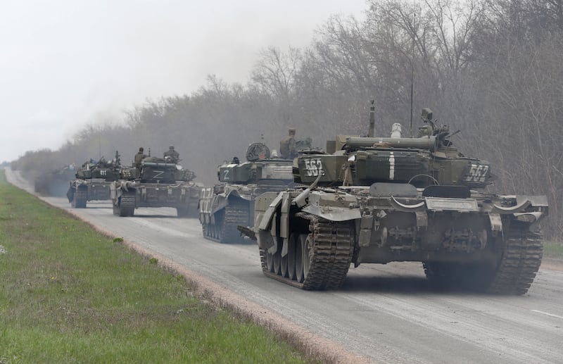 Pro-Russian troops drive tanks near Mariupol. Reuters