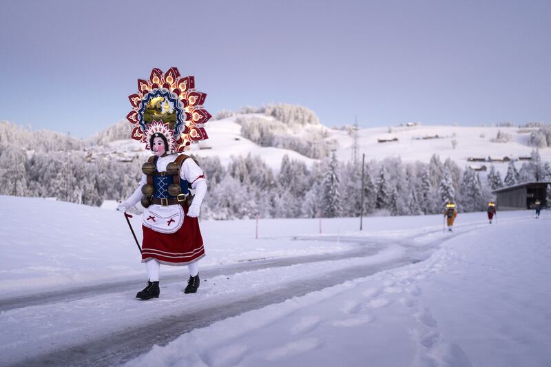 The so-called 'Silvesterchlausen' (New Years Clause) are on their way to offer the best wishes for the New Year (following the Julian calendar) to the farmers in this region, in Hundwil, Switzerland, 13 January 2024.   EPA / GAETAN BALLY