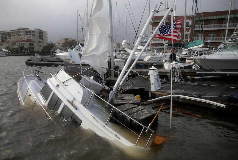 An U.S. flag flies from a boat damaged by Hurricane Sally in Pensacola, Florida, U.S. REUTERS