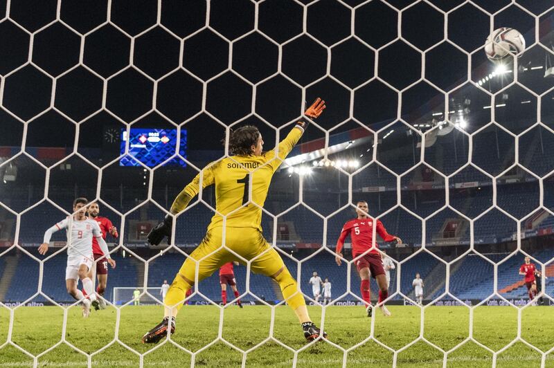 Spain's Gerard Moreno scores against Switzerland's goalkeeper Yann Sommer in a 1-1 drawEPA