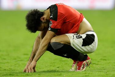 Egypt's Mohamed Salah reacts after the African Cup of Nations 2022 final soccer match between Senegal and Egypt at the Ahmadou Ahidjo stadium in Yaounde, Cameroon, Sunday, Feb.  6, 2022.  (AP Photo / Sunday Alamba)