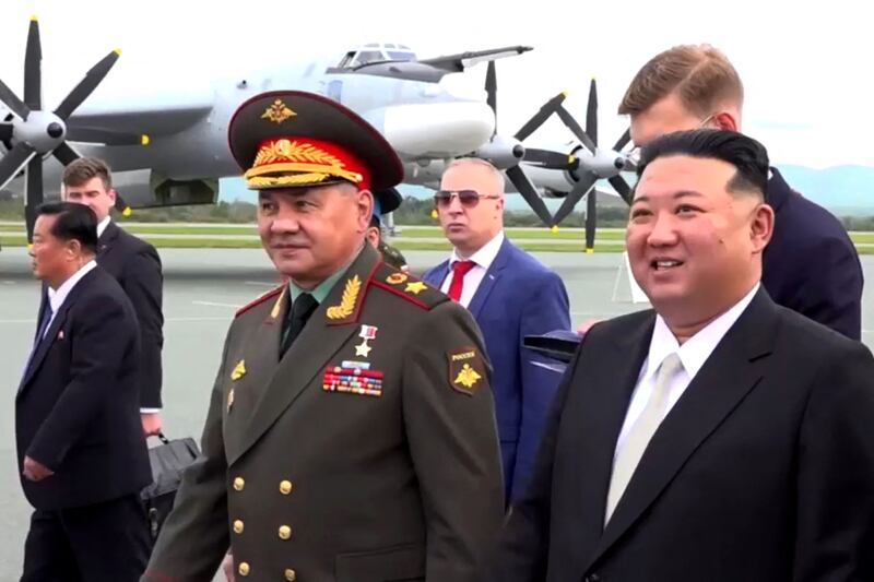 Russian Defence Minister Sergey Shoigu, centre, takes North Korean leader Kim Jong-un, right, on a tour of a military site in far eastern Russia on Saturday. AFP