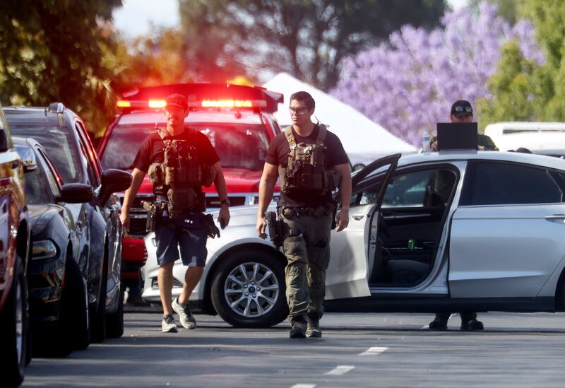 Police at the scene in Laguna Woods, California. AFP