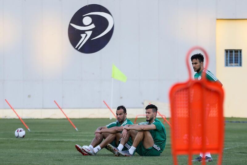 Algerian players take a break during a training session at Petrosport Stadium in Cairo ahead of the 2019 Africa Cup of Nations Round of 16 match against Guinea.  AFP