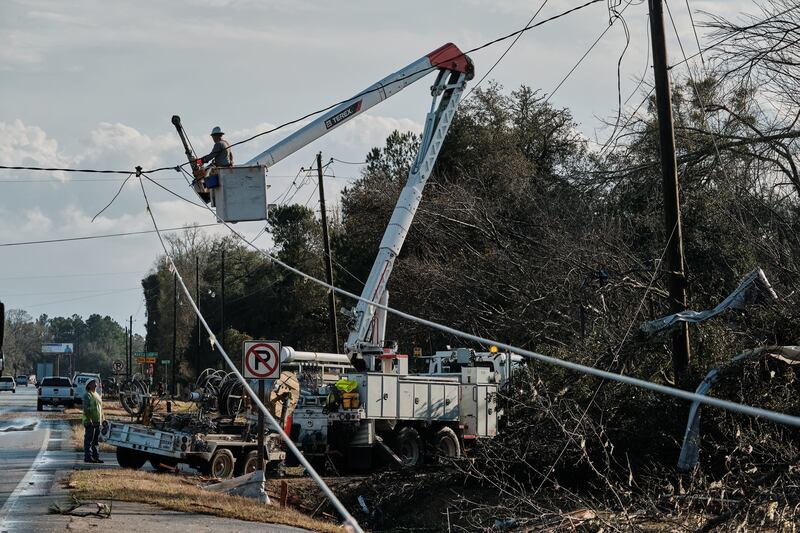Emergency crews work on downed power lines in Mount Vernon. EPA