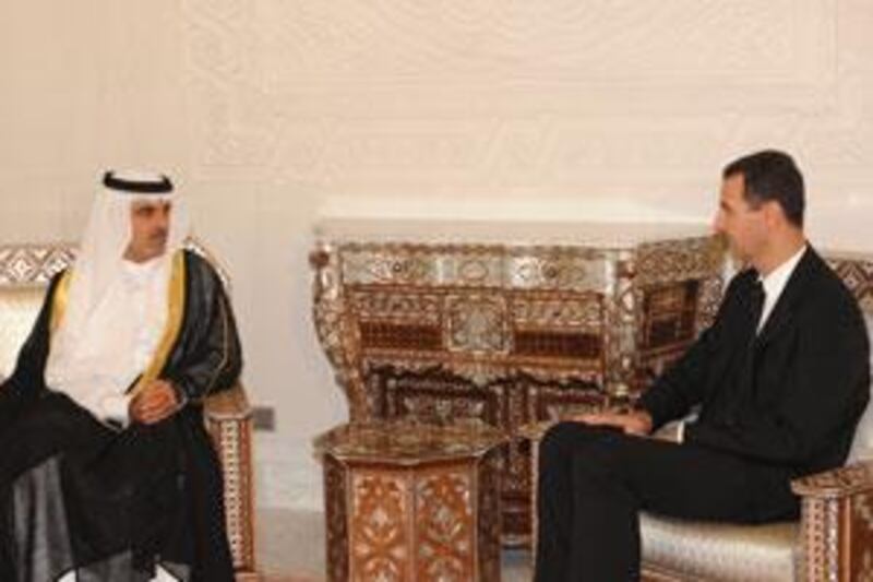 Abdul Aziz al Ghurair, the Speaker of the Federal National Council, left, meets the Syrian president Bashar Assad.