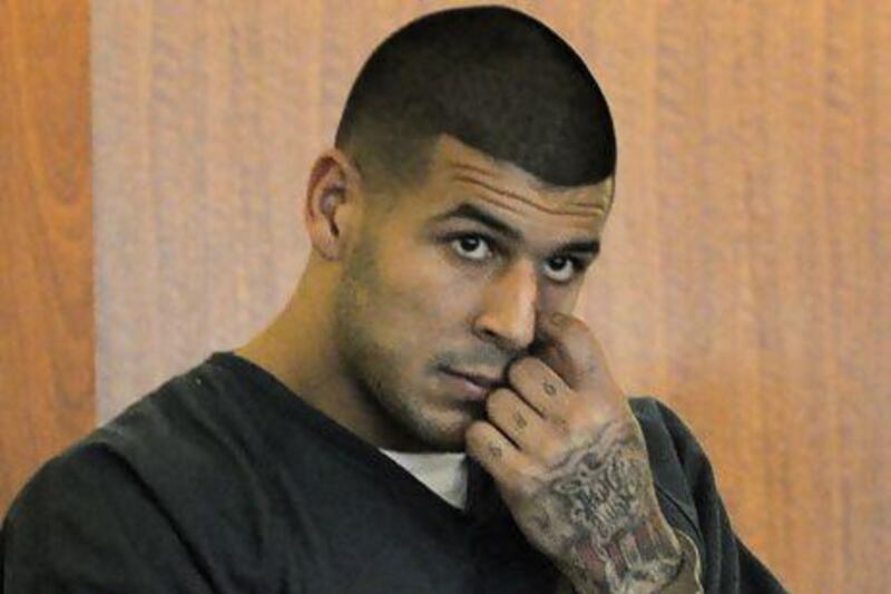 Former New England Patriots football player Aaron Hernandez stands during a bail hearing in Fall River Superior Court on June 27 in Fall River, Mass. Hernandez, charged with murdering Odin Lloyd, a 27-year-old semi-pro football player, was denied bail. Ted Fitzgerald / AP Photo