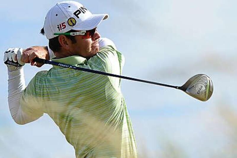 Louis Oosthuizen admires his drive from the sixth tee during his second round yesterday. He will partner Paul Casey today.