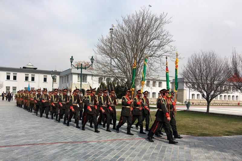 Afghan honour guards walk ahead of the oath inauguration ceremony of Afghanistan's President Ashraf Ghani, at the Presidential Palace in Kabul.  AFP