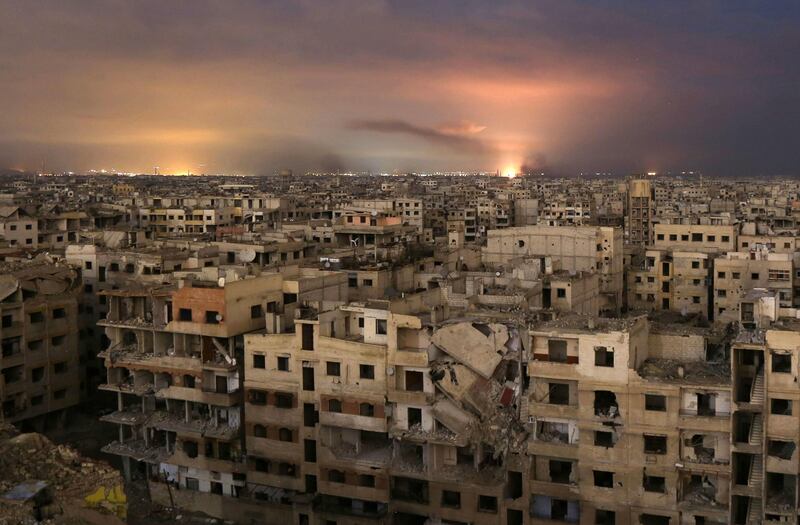 Smoke billows following a regime air strike on the besieged Eastern Ghouta region on the outskirts of the capital Damascus, late on February 23, 2018.
Syrian regime air strikes and artillery fire hit the rebel-held enclave of Eastern Ghouta for a sixth straight day killing 32 civilians, as the world struggled to reach a deal to stop the carnage. / AFP PHOTO / Ammar SULEIMAN