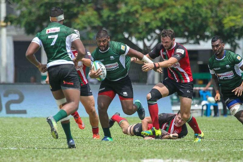 UAE fly-half Luke Stevenson, second right, attempts to tackle a Sri Lanka player during the Emirates' 33-17 defeat in the Asian Rugby Championship Division 1 match in Ipoh, Malaysia. Asia Rugby / Tigers Super Sports Media