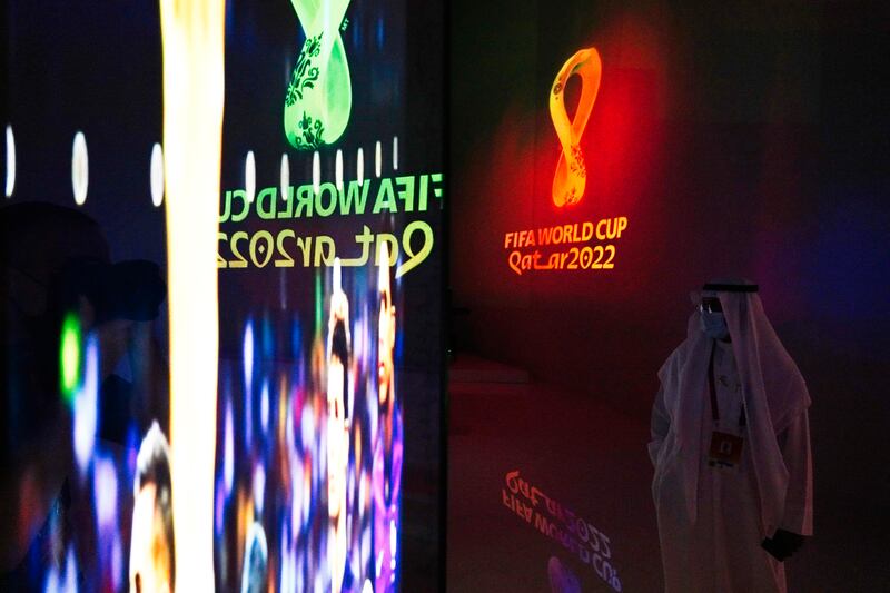 A Qatari walks through the pavilion as it advertises the upcoming FIFA 2022 World Cup at Expo 2020 Dubai. AP Photo / Jon Gambrell
