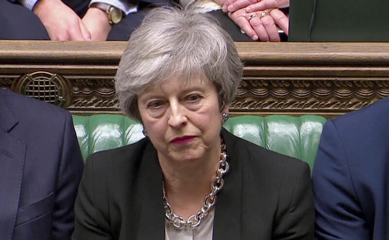 Britain's Prime Minister Theresa May listens as Jeremy Corbyn speaks, after the voting in Parliament, London, Britain, January 29, 2019, in this screen grab taken from video. Reuters TV via REUTERS