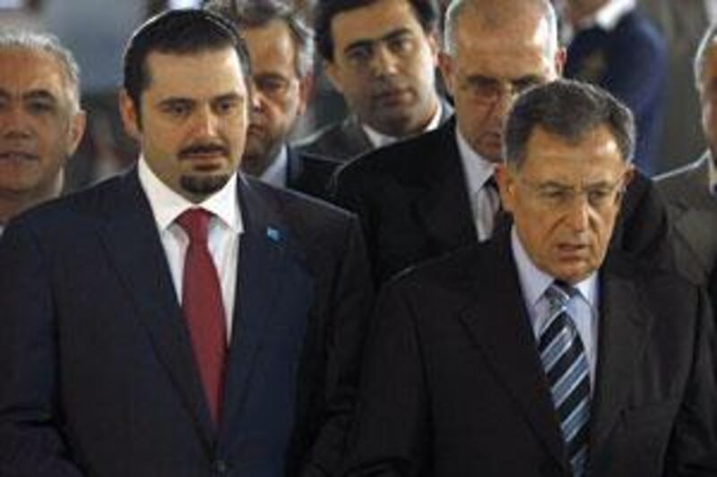 The outgoing Lebanese prime minister Fouad Siniora and premier-designate Saad Hariri.