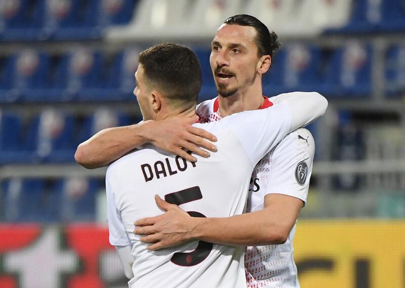 AC Milan's Zlatan Ibrahimovic and Diogo Dalot celebrate after the win over Cagliari. Reuters