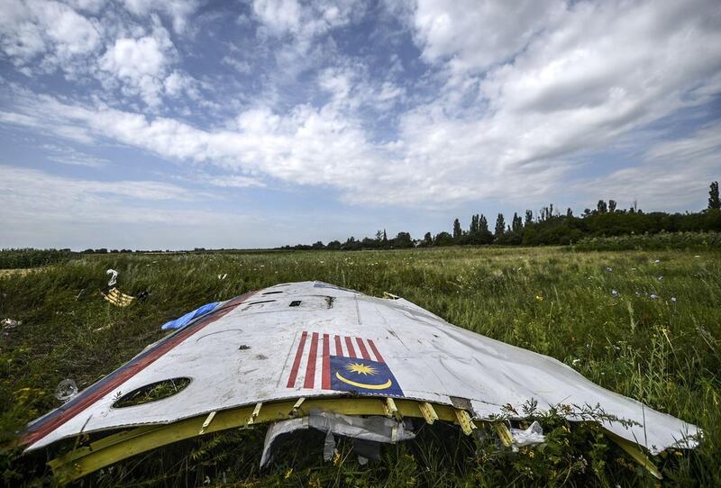 A piece of the wreckage of the Malaysia Airlines flight MH17 lies in a field near the village of Grabove, in the region of Donetsk. The missile which brought down Flight MH17 two years ago over eastern Ukraine was transported into the area from Russia, a Dutch-led investigation found on September 28. Bulent Kilic / AFP 