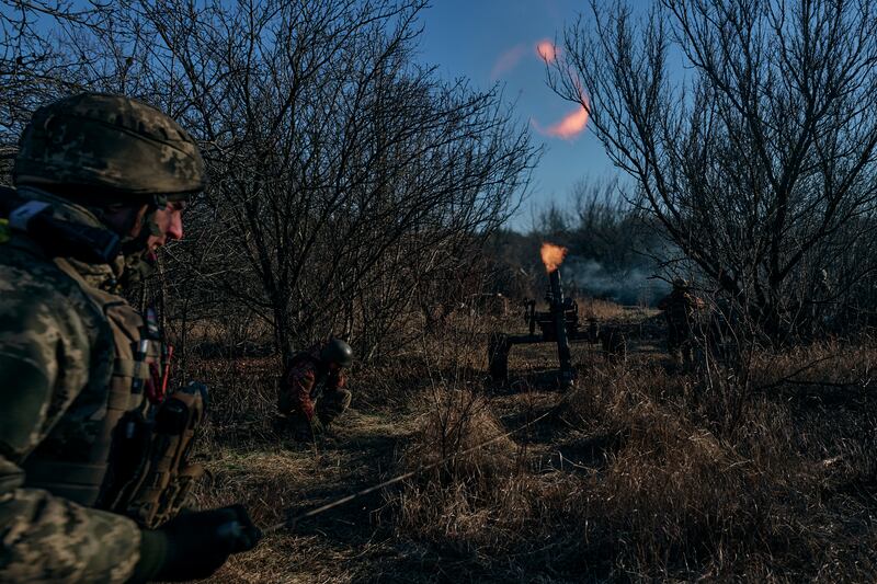 Ukrainian soldiers fire at Russian positions at the frontline near Bakhmut in the Donetsk region. AP