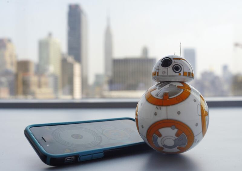 This Thursday, Sept. 3, 2015 photo shows Sphero's BB-8 droid toy in New York. The BB-8 is controlled with a smartphone or tablet app and responds to basic voice commands such as “wake up,” and “look around.” It’s just under 5-inches tall and makes cute little Droid sounds reminiscent of R2-D2. (AP Photo/Patrick Sison)