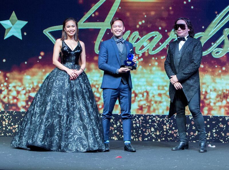 Dubai, United Arab Emirates- Paul Aggarao winner Film Maker of the Year Individual Category awarded by Karen Remo and fashion designer Michael Cinco at the Filipino Times award at Sofitel at The Palm.  Ruel Pableo for The National