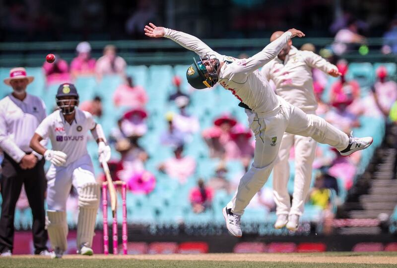 Australia's Matthew Wade dives unsuccessfully to take a catch from India's Hanuma Vihari during day three of the third cricket Test match between Australia and India at the Sydney Cricket Ground (SCG). AFP