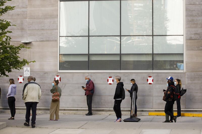 People queue up outside a Covid-19 testing centre at Women's College Hospital in Toronto, Ontario, Canada, on September 18. Cole Burston/Bloomberg