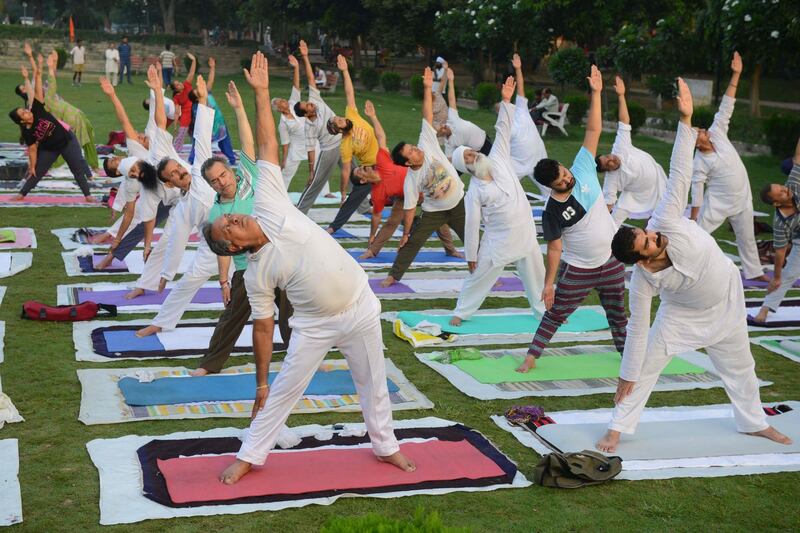 Indian yoga practitioners take part in a yoga session ahead of International Yoga Day at a park in Amritsar.   Narinder Nanu / AFP Photo
